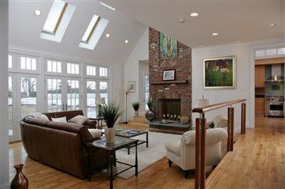 304 Parker Road Osterville, MA 02655 - Photo 8 of 15 a living room with furniture a flat screen tv and a fireplace