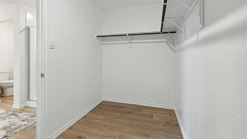120 Pheasant Run Road Lavon, TX 75166 - Photo 11 of 17 Walk in closet featuring light wood-type flooring
