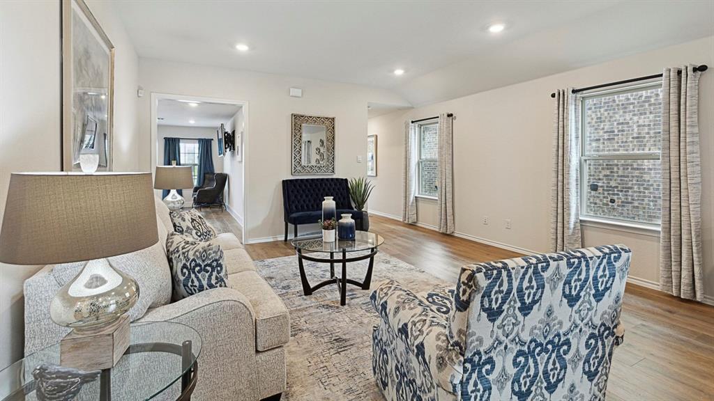120 Pheasant Run Road Lavon, TX 75166 - Photo 12 of 17 Living room featuring light wood-style floors, recessed lighting, and vaulted ceiling