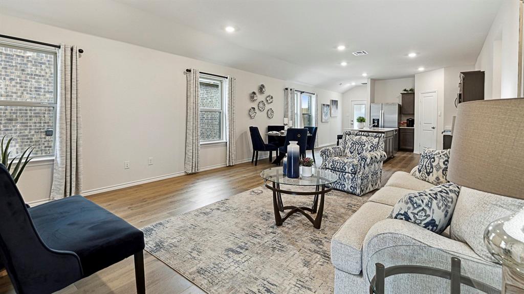 120 Pheasant Run Road Lavon, TX 75166 - Photo 15 of 17 Living room with light wood-type flooring, recessed lighting, and vaulted ceiling