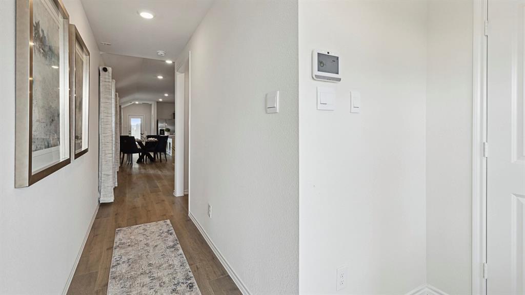 120 Pheasant Run Road Lavon, TX 75166 - Photo 3 of 17 Hallway with dark wood-style floors and recessed lighting