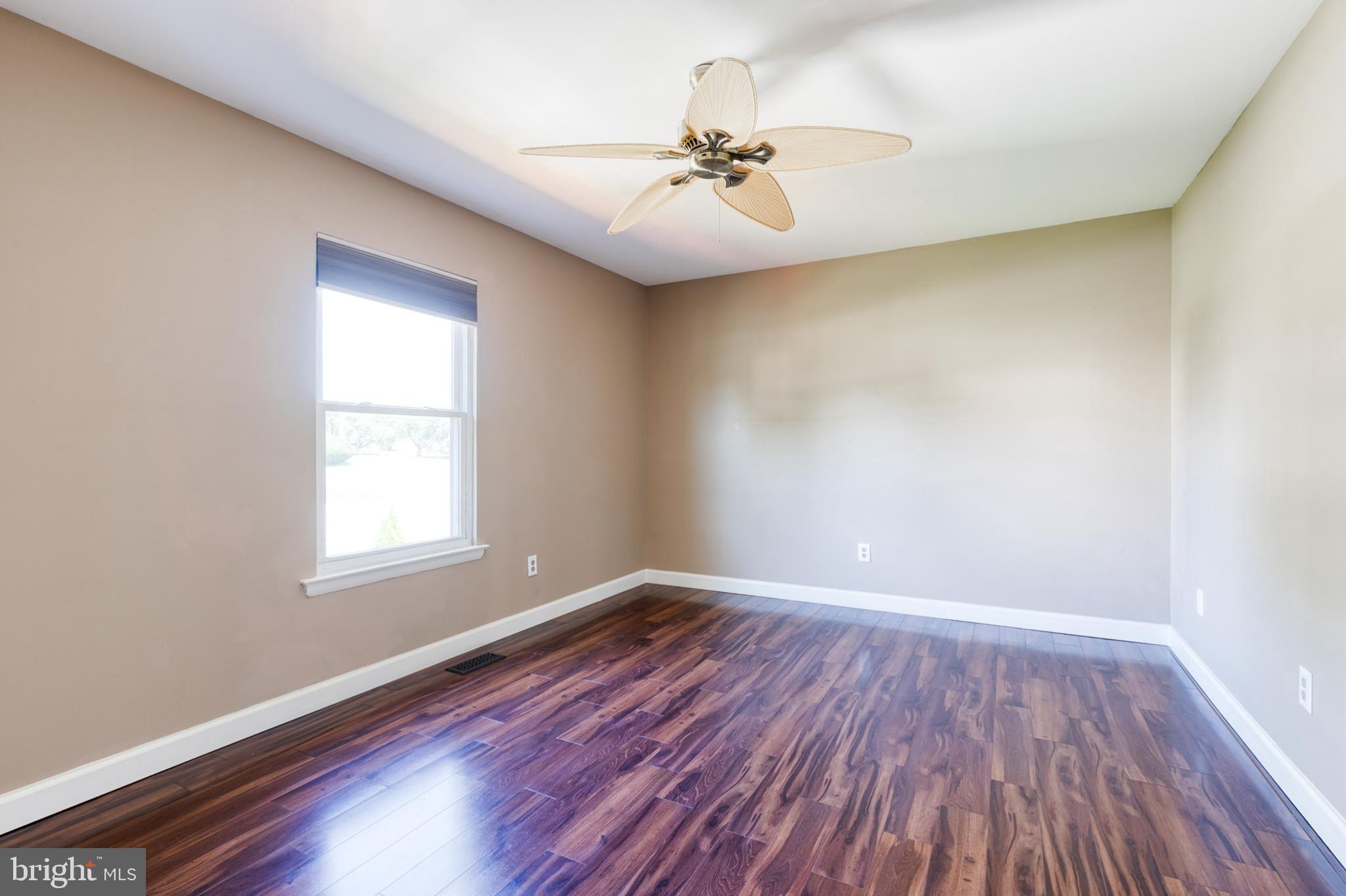28 Patrick Court Abingdon, MD 21009 - Photo 14 of 22 wooden floor in an empty room with a window