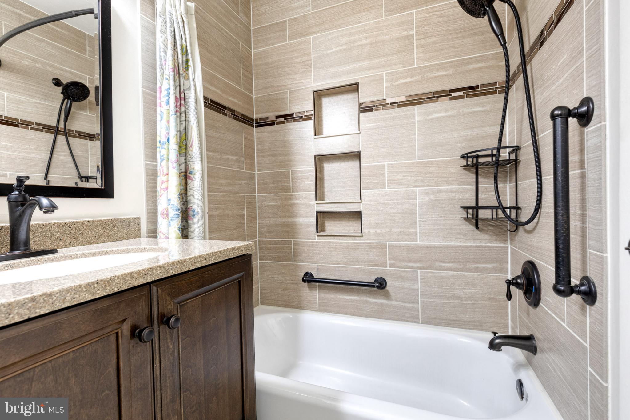 28 Patrick Court Abingdon, MD 21009 - Photo 16 of 22 a bathroom with a granite countertop sink a toilet and shower