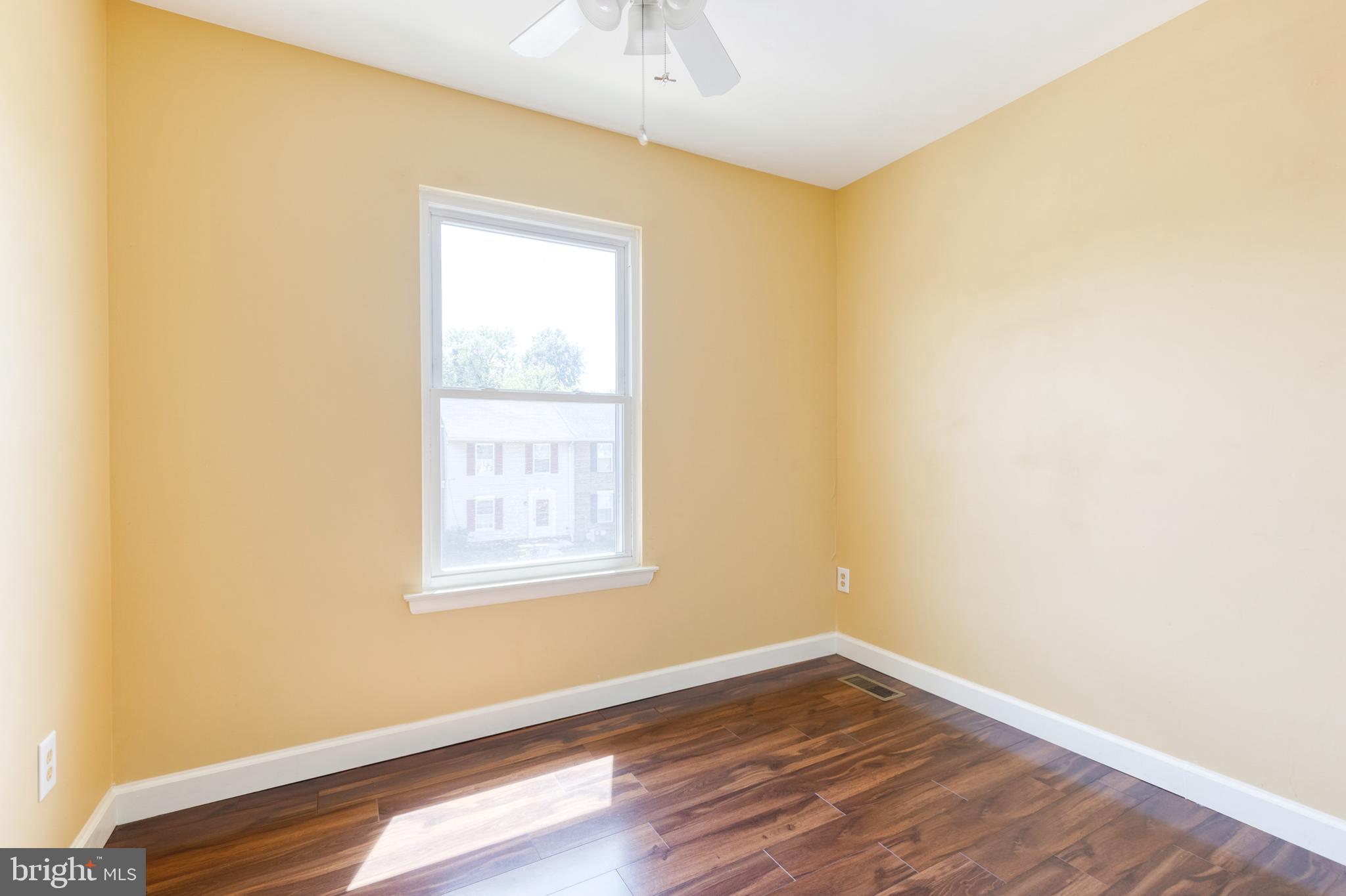 28 Patrick Court Abingdon, MD 21009 - Photo 18 of 22 a view of an empty room with wooden floor and a window