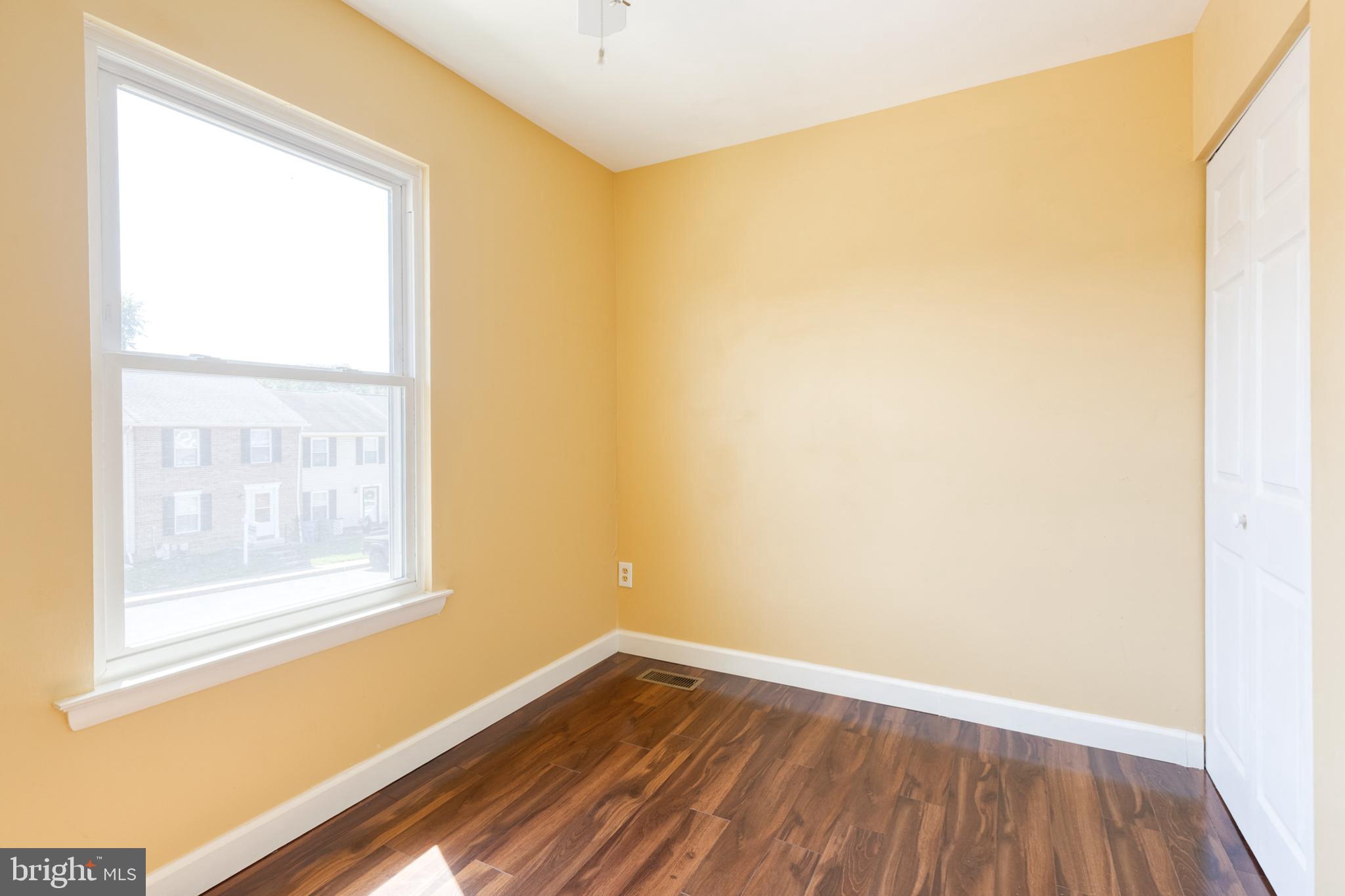 28 Patrick Court Abingdon, MD 21009 - Photo 19 of 22 a view of an empty room with wooden floor and a window