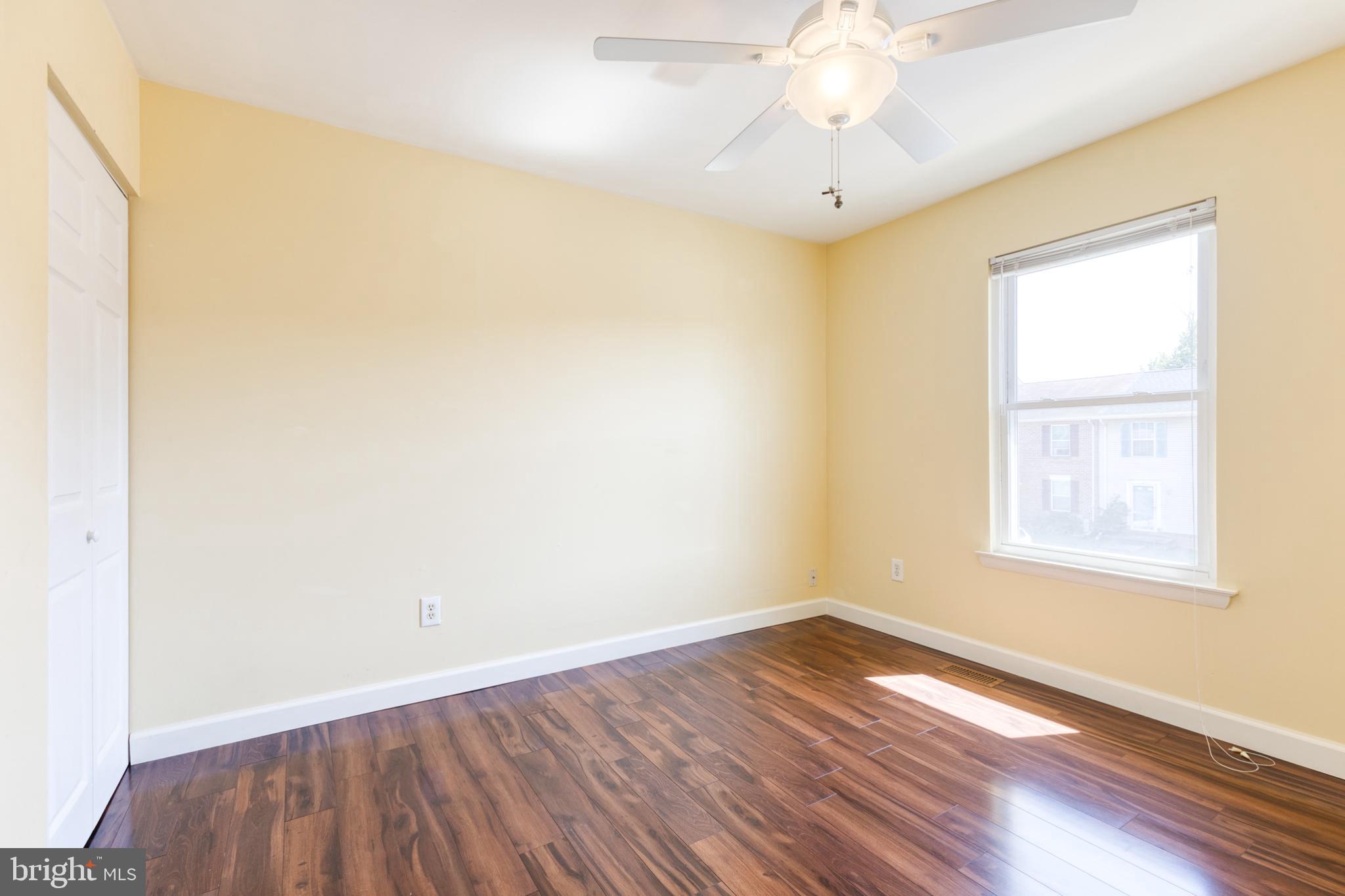 28 Patrick Court Abingdon, MD 21009 - Photo 20 of 22 wooden floor in an empty room with a window