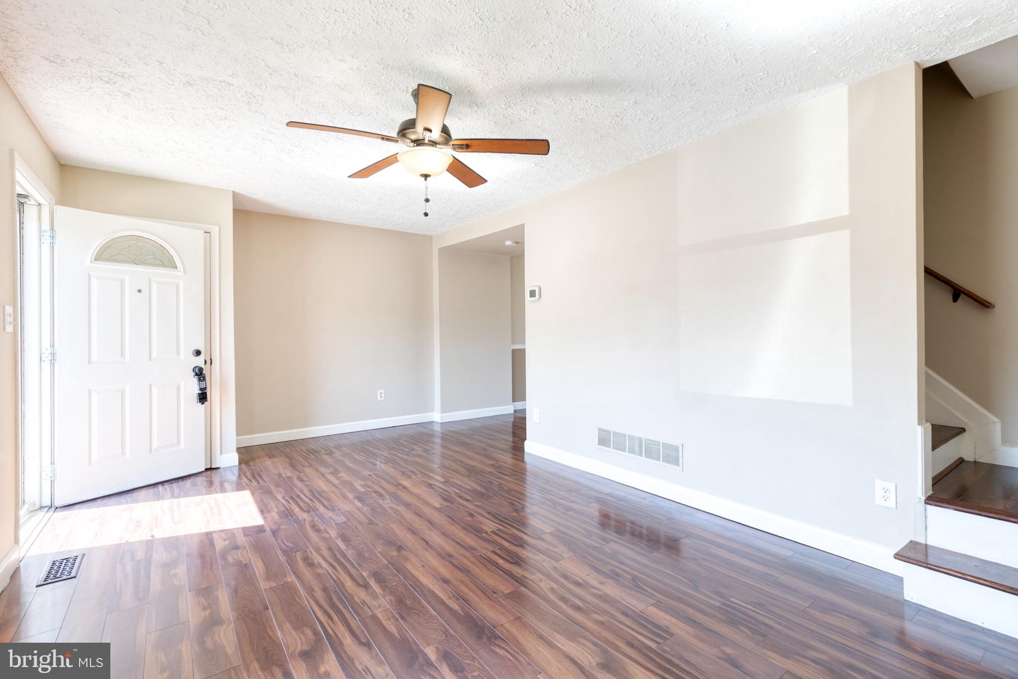 28 Patrick Court Abingdon, MD 21009 - Photo 4 of 22 wooden floor in an empty room with a window