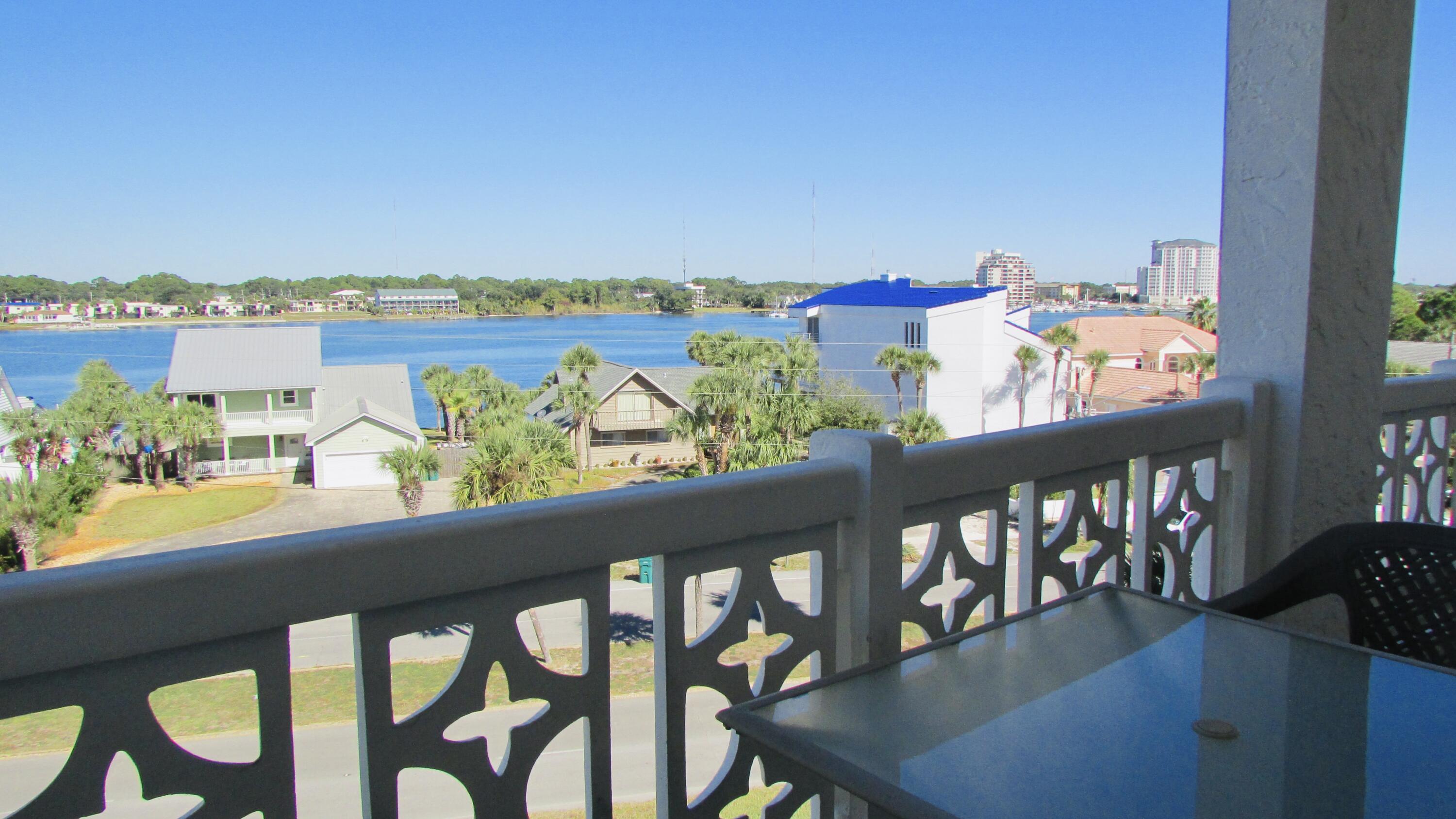 a view of a chairs and table in patio