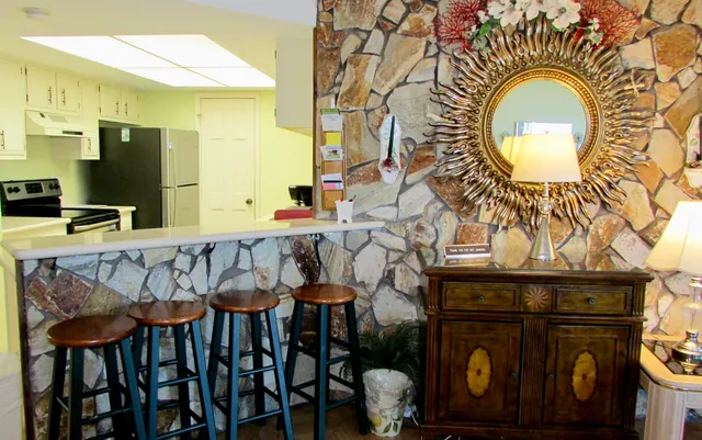 a kitchen with a sink and a refrigerator