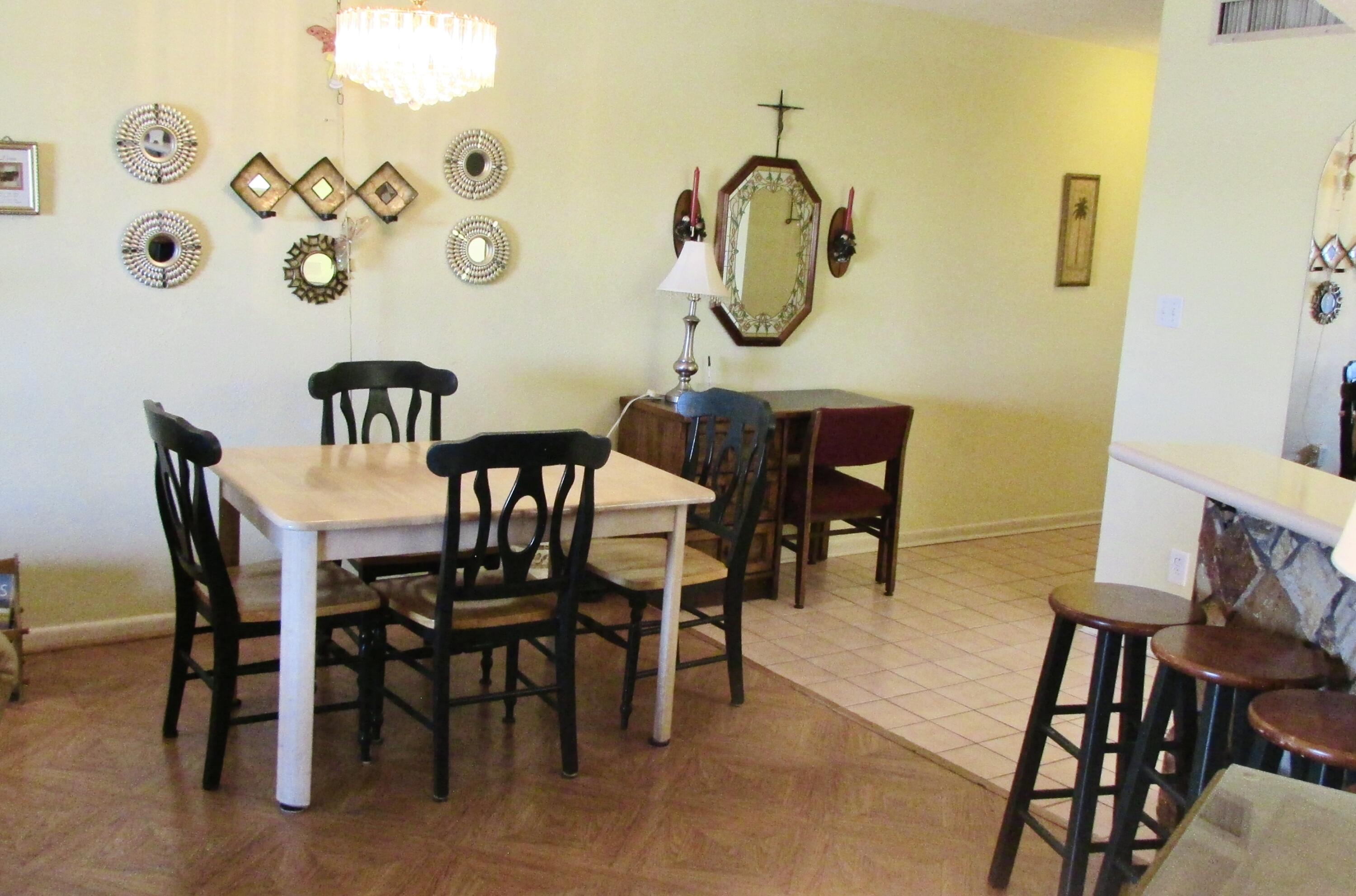 909 Santa Rosa Boulevard, Unit 555 Fort Walton Beach, FL 32548 - Photo 7 of 12 a view of a dining room with furniture