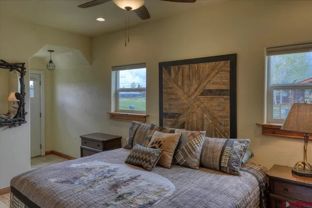 a bedroom with a bed and window