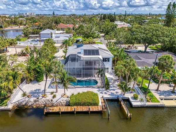 an aerial view of a house with a lake view