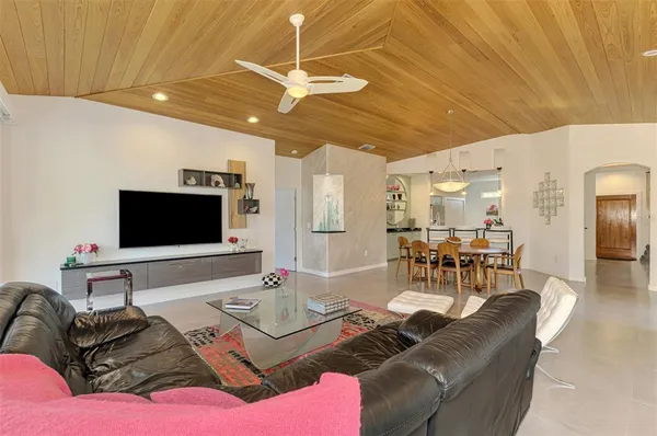 a kitchen with stainless steel appliances granite countertop a sink and a refrigerator