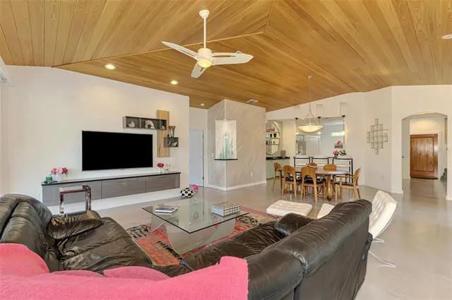 a kitchen with stainless steel appliances granite countertop a sink and a refrigerator