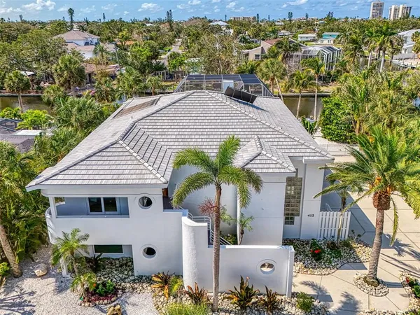 a aerial view of a house with a yard