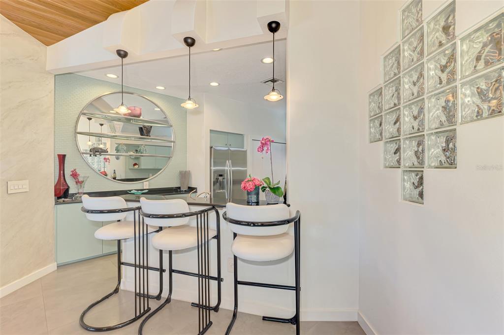 412 Treasure Boat Way Sarasota, FL 34242 - Photo 24 of 91 a room that has a table and a chandelier