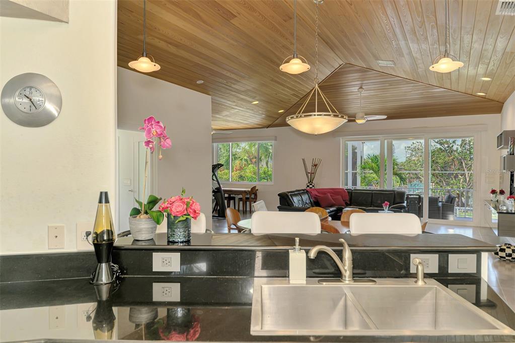 412 Treasure Boat Way Sarasota, FL 34242 - Photo 31 of 91 a view of a dining room with furniture a chandelier and a large window