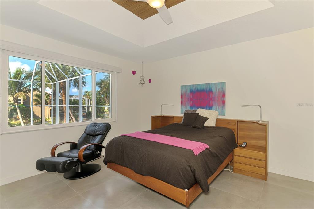 412 Treasure Boat Way Sarasota, FL 34242 - Photo 32 of 91 a bedroom with a bed and a couch