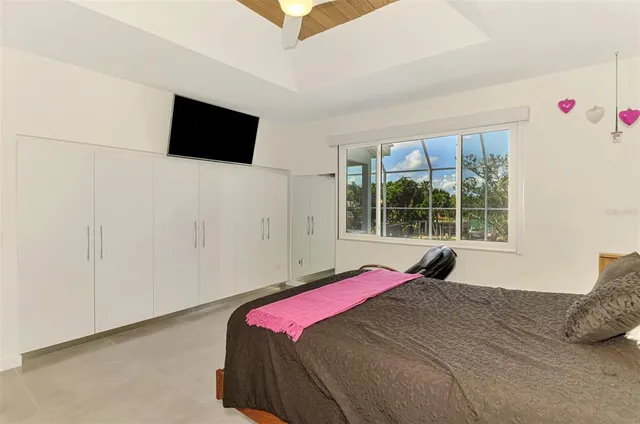 a view of a house with a backyard and sitting area