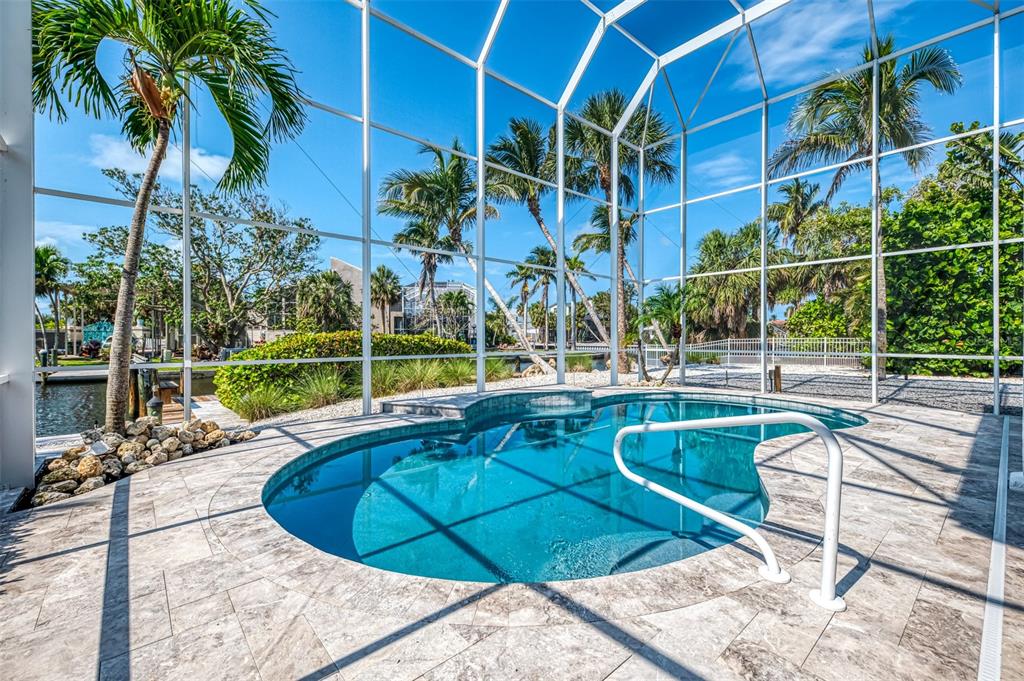 412 Treasure Boat Way Sarasota, FL 34242 - Photo 53 of 91 a view of a swimming pool with a patio