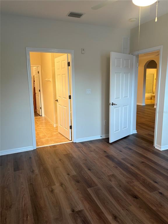 8168 Boat Hook Loop, Unit 707 Windermere, FL 34786 - Photo 12 of 17 a view of an empty room with wooden floor and a window