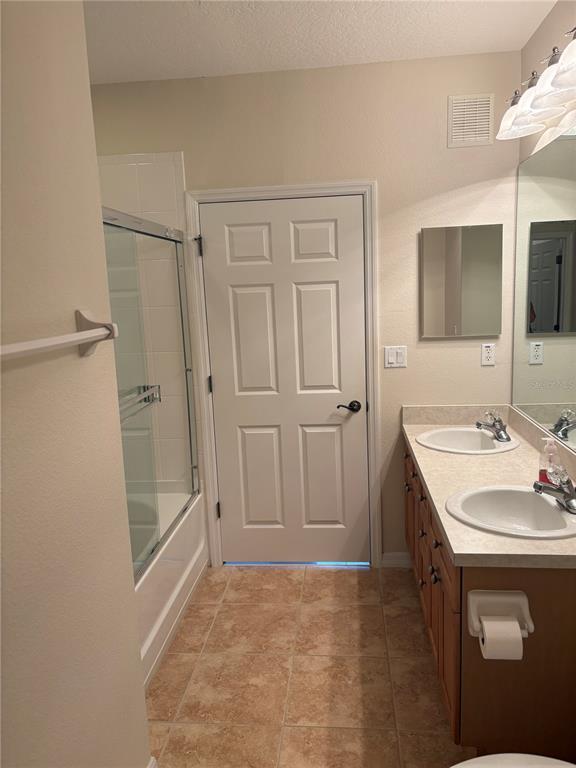 8168 Boat Hook Loop, Unit 707 Windermere, FL 34786 - Photo 14 of 17 a bathroom with a sink a toilet and shower
