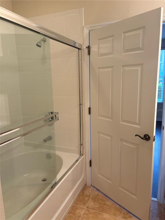 8168 Boat Hook Loop, Unit 707 Windermere, FL 34786 - Photo 15 of 17 a bathroom with a bathtub and a shower