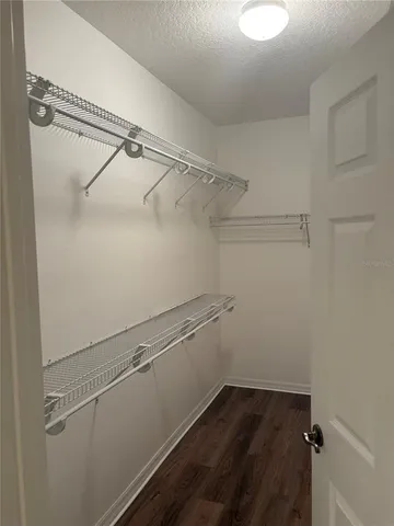 a view of a room with racks on the wall