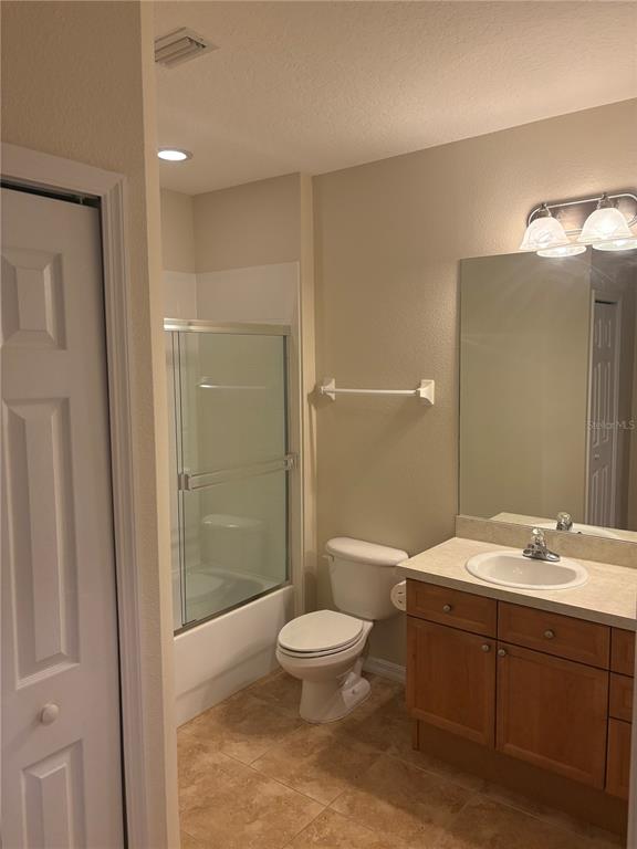 8168 Boat Hook Loop, Unit 707 Windermere, FL 34786 - Photo 5 of 17 a bathroom with a sink a toilet and shower