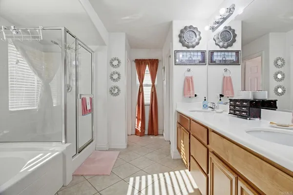 a bathroom with a sink a mirror and a shower