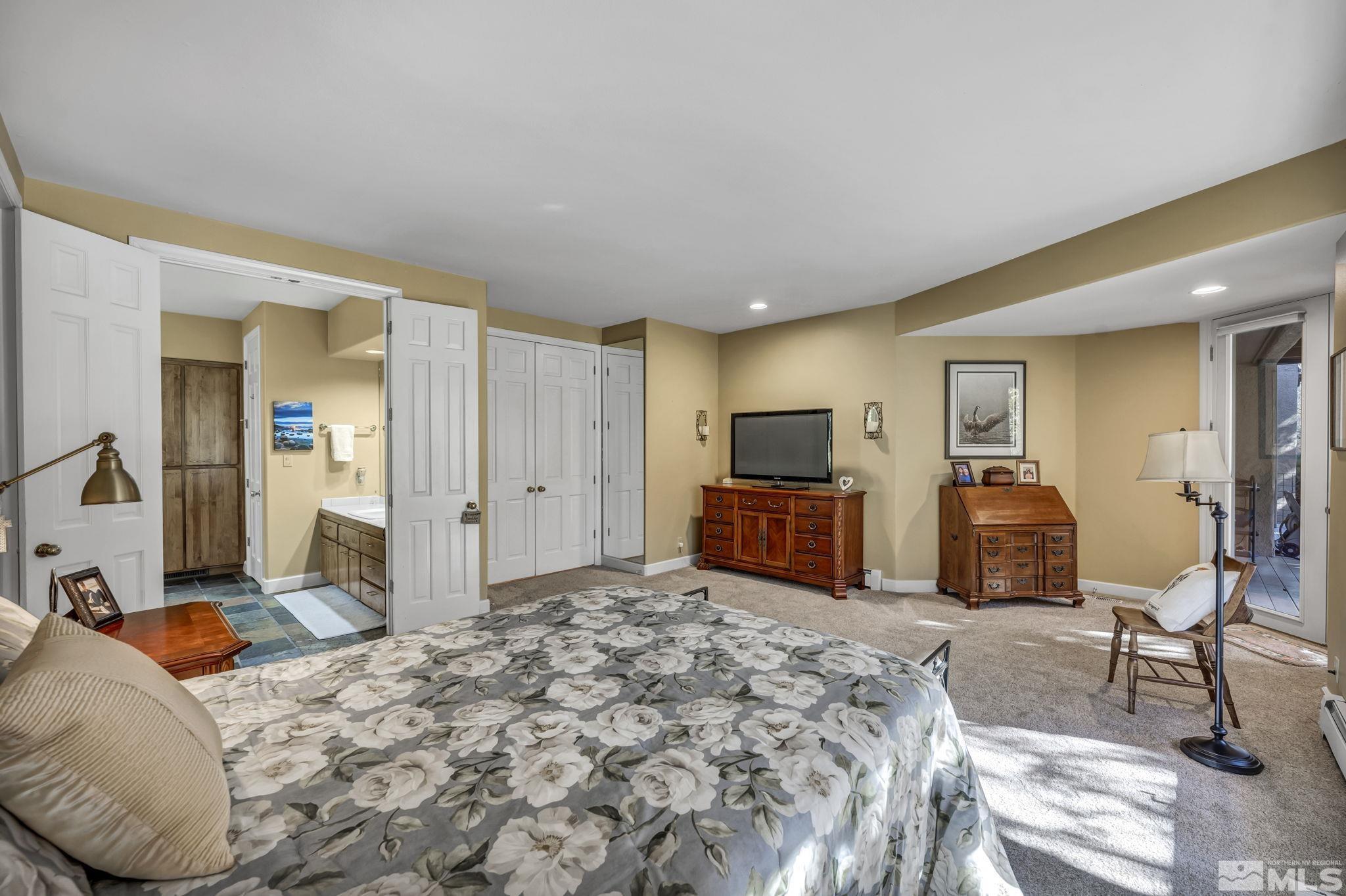 4277 Bitteroot Road Reno, NV 89519 - Photo 26 of 40 a bedroom with furniture and a flat screen tv