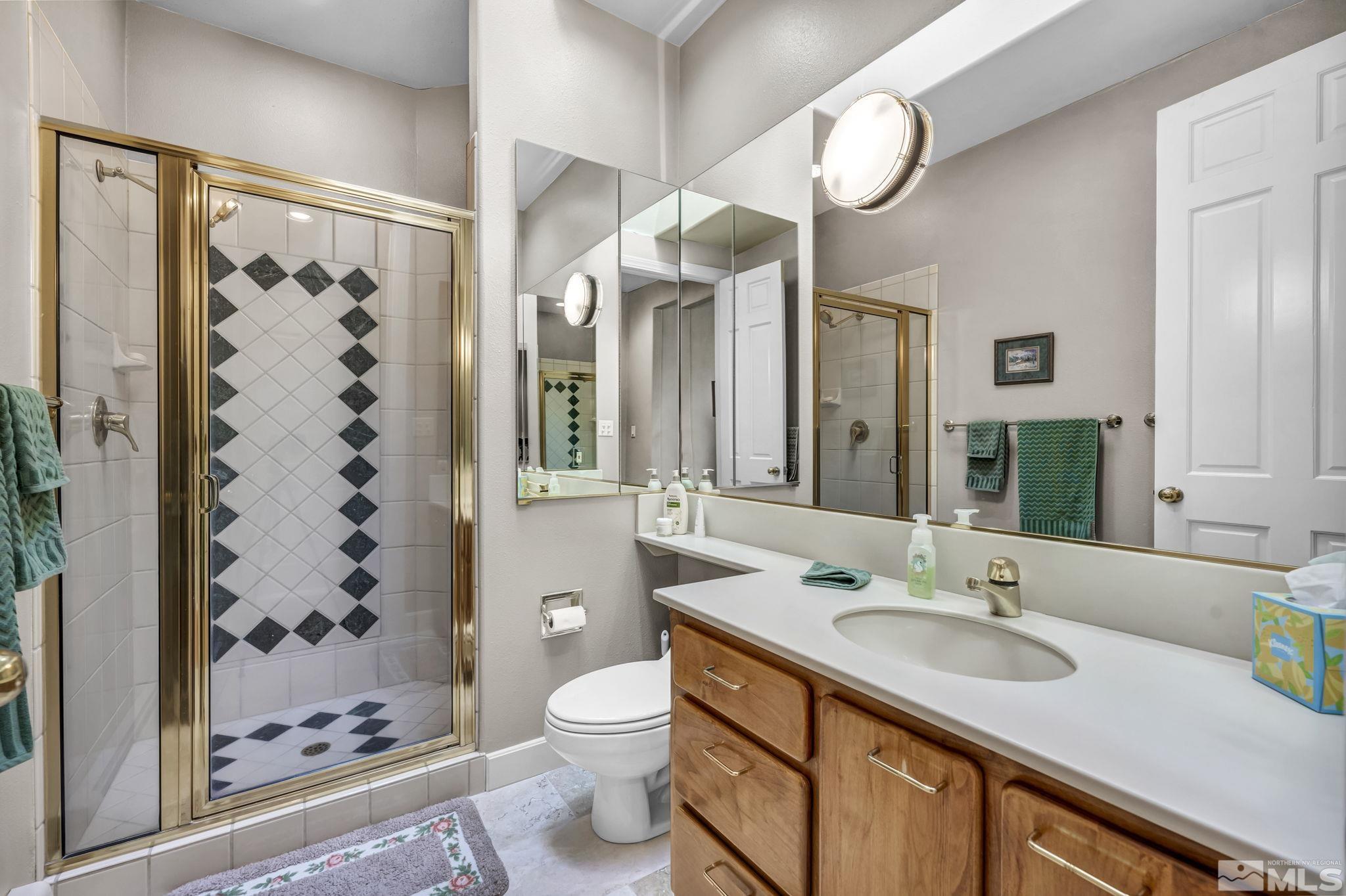 4277 Bitteroot Road Reno, NV 89519 - Photo 29 of 40 a bathroom with a sink and a mirror
