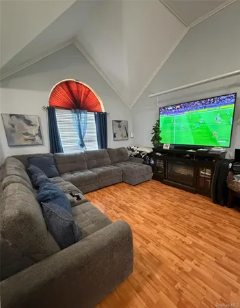 a living room with a couch and a flat screen tv