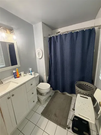 a bathroom with a sink toilet and vanity