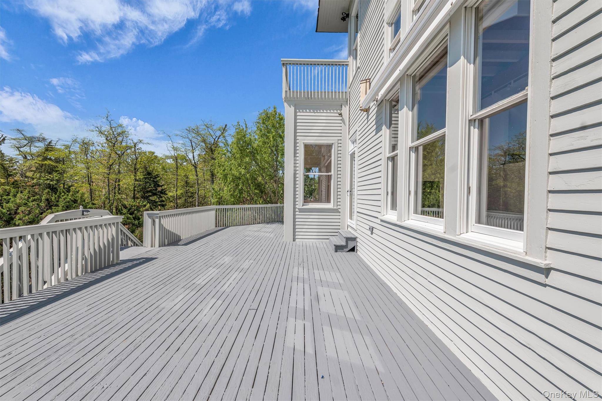 238 Beaver Dam Road Brookhaven, NY 11719 - Photo 32 of 44 a view of a house with a deck