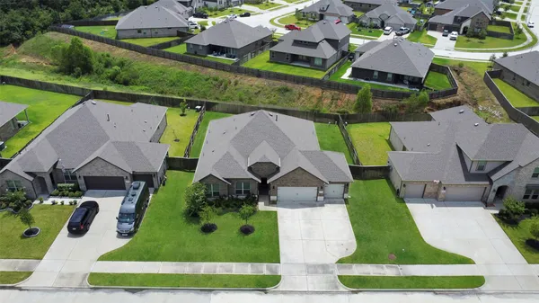 an aerial view of house with yard swimming pool and outdoor seating