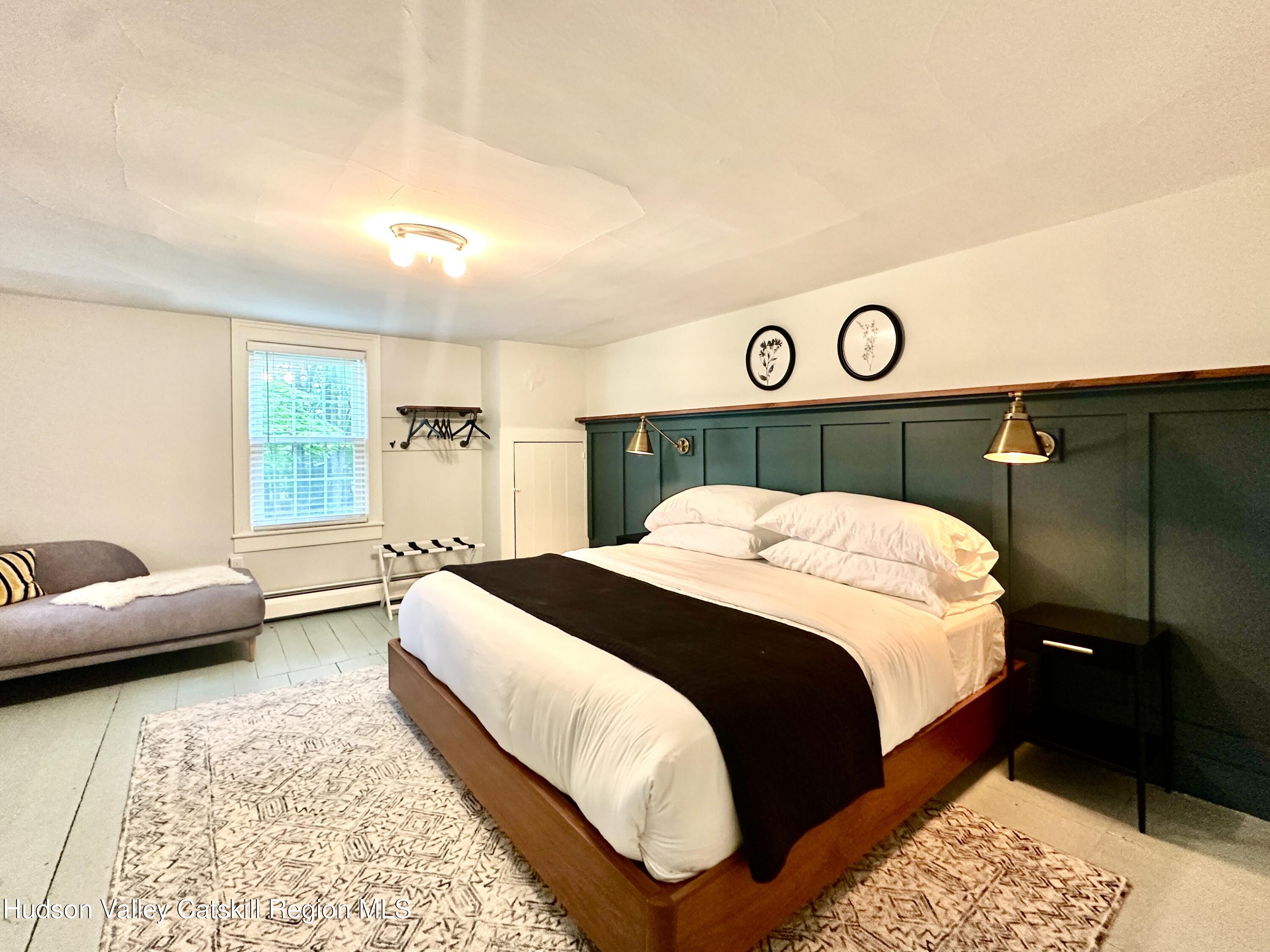 4028-4082 County Rte 26 Greenville, NY 12083 - Photo 21 of 77 a bedroom with a bed and a couch