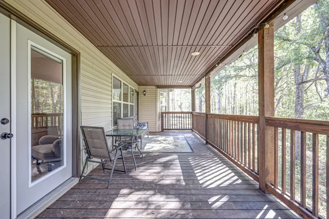 a view of two chairs in the balcony