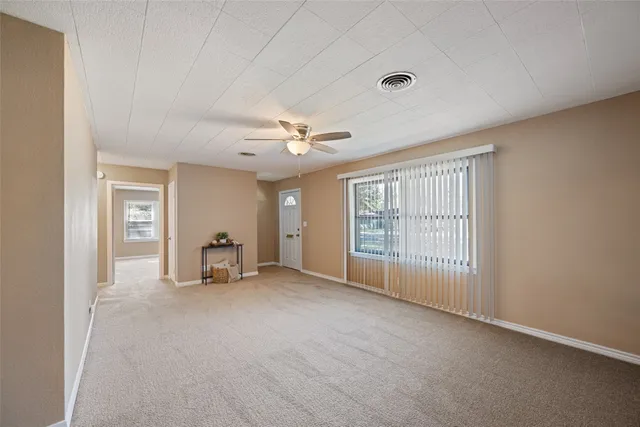 a view of an empty room with a window