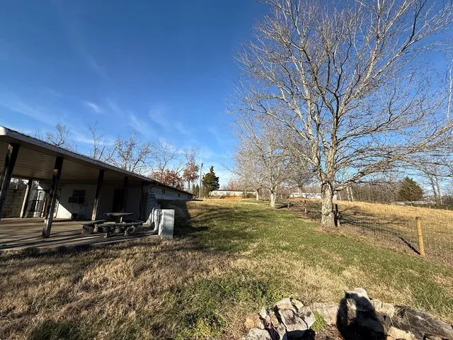 a view of a yard with an ocean view