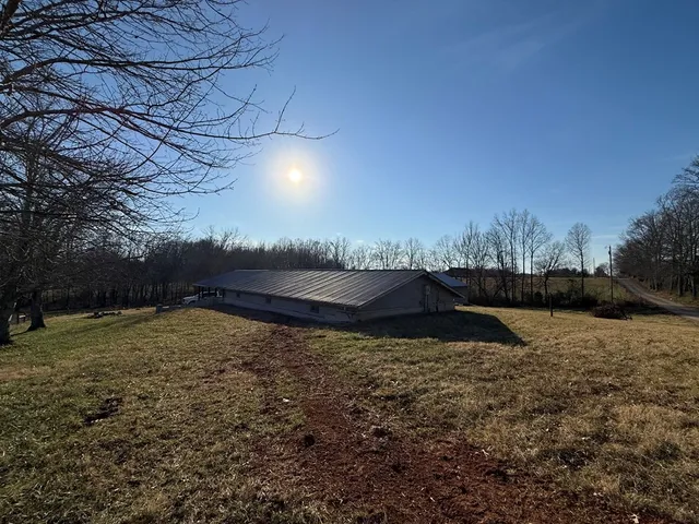 a view of a backyard of the house