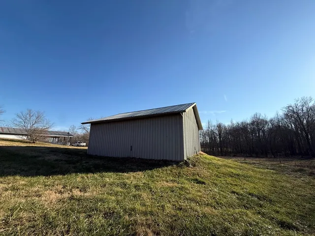 a kitchen with a sink and dishwasher a stove with wooden floor