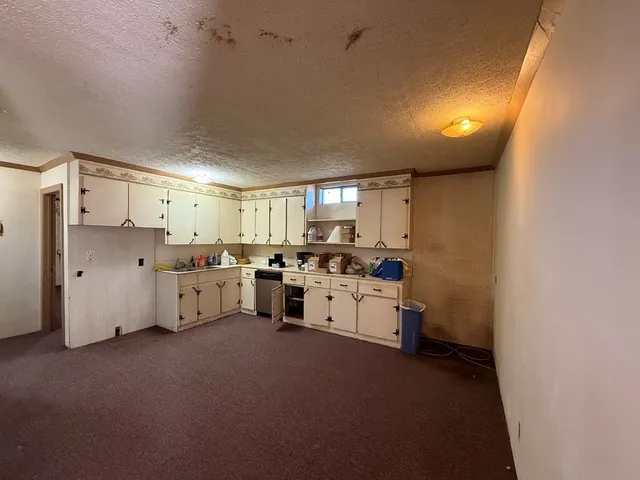 a view of a livingroom with a furniture