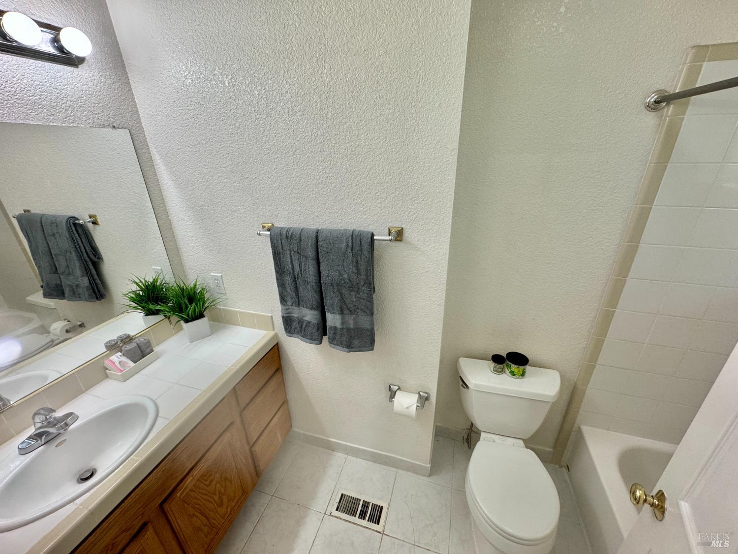 1836 Hearn Avenue Santa Rosa, CA 95407 - Photo 11 of 22 a bathroom with a toilet sink and mirror