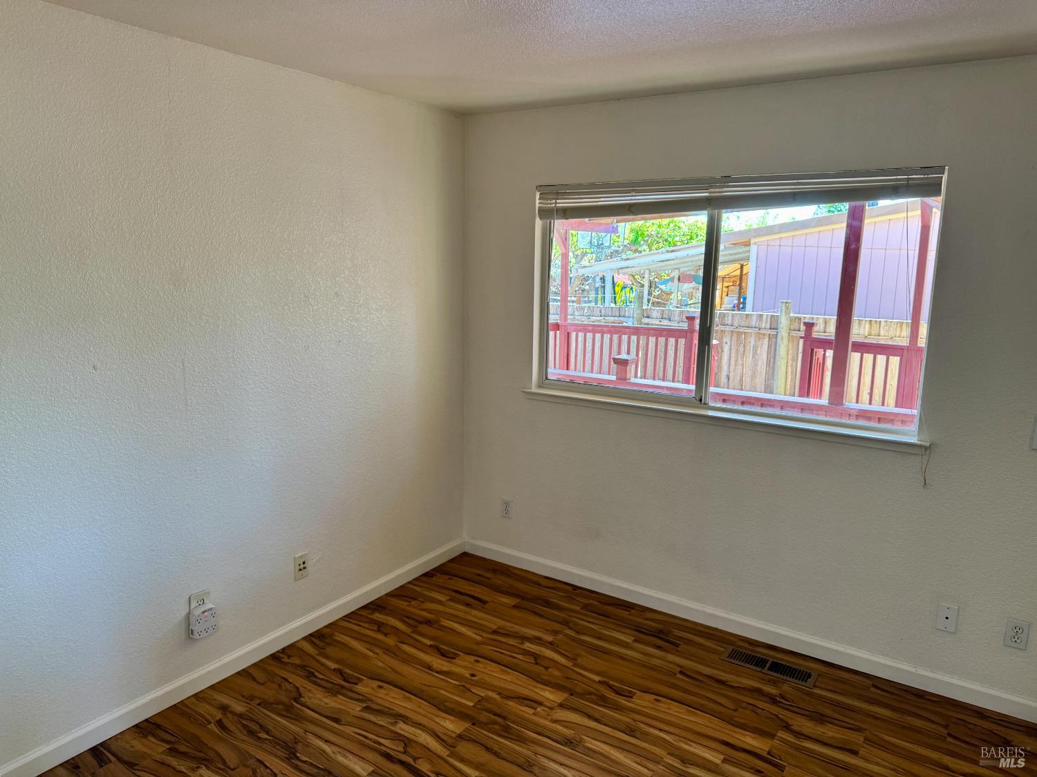 1836 Hearn Avenue Santa Rosa, CA 95407 - Photo 12 of 22 a view of a room with wooden floor and windows