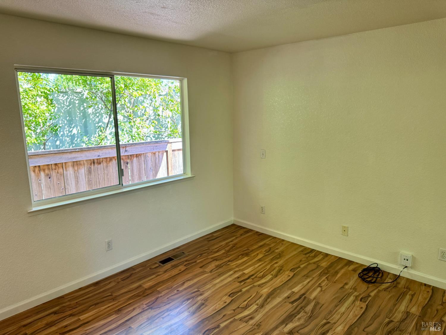 1836 Hearn Avenue Santa Rosa, CA 95407 - Photo 14 of 22 a view of a room with wooden floor and a window