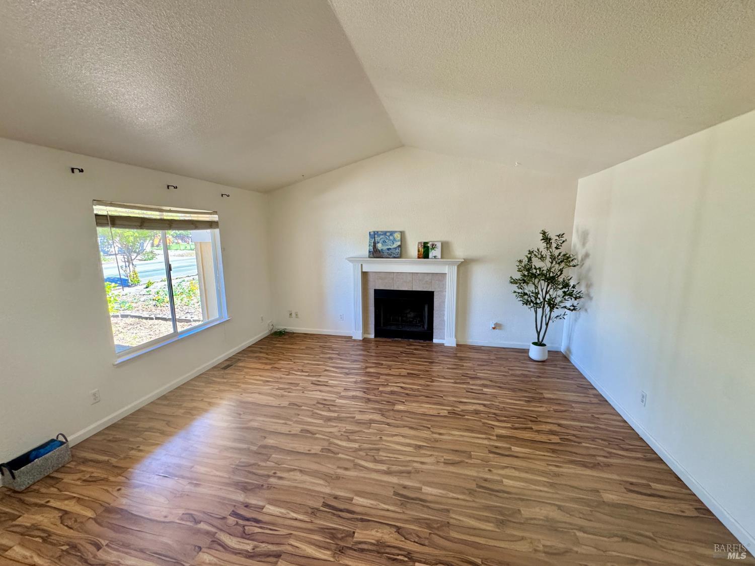 1836 Hearn Avenue Santa Rosa, CA 95407 - Photo 4 of 22 a view of empty room with a fireplace and wooden floor