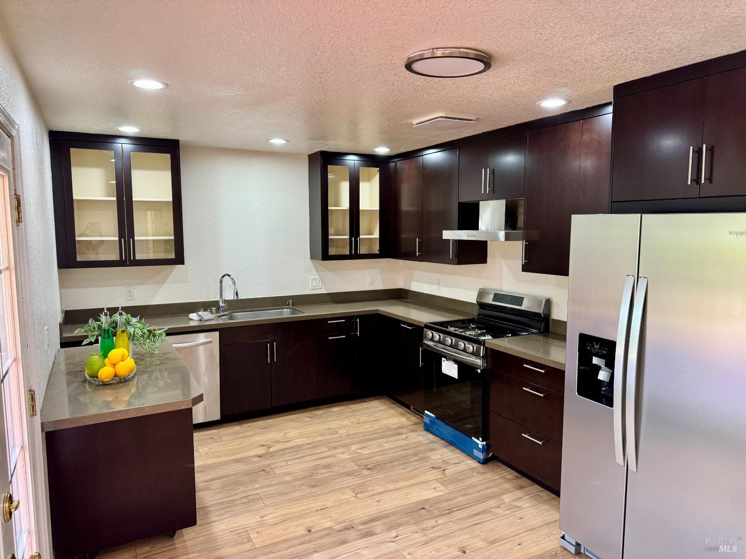 1836 Hearn Avenue Santa Rosa, CA 95407 - Photo 5 of 22 a kitchen with stainless steel appliances granite countertop a refrigerator and a stove