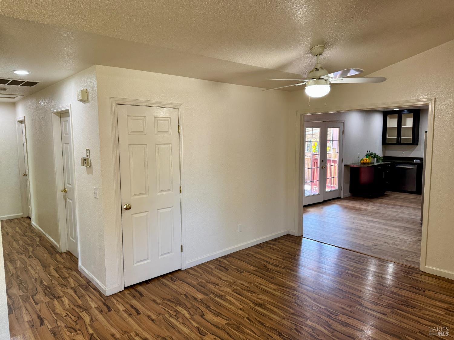 1836 Hearn Avenue Santa Rosa, CA 95407 - Photo 7 of 22 a view of a hallway with wooden floor and a living room