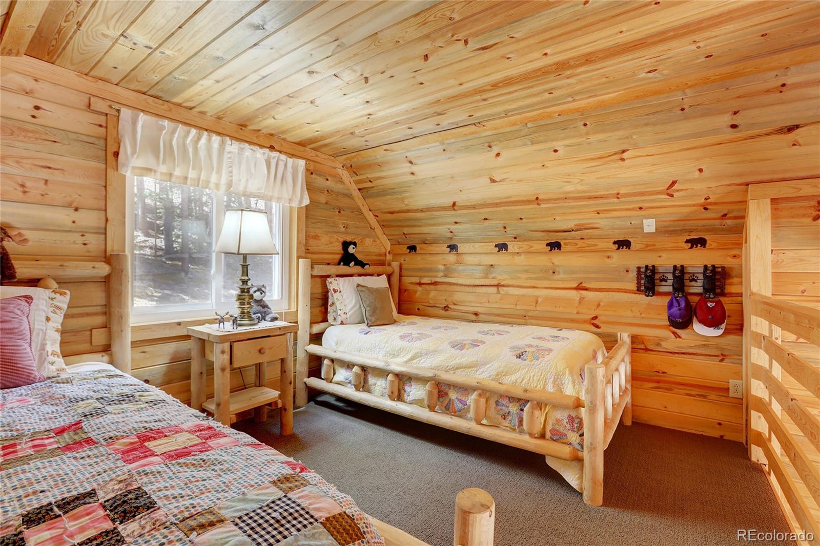 7721 County Road 43 Bailey, CO 80421 - Photo 33 of 49 a bedroom with a bed and large window